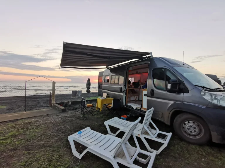 Tent camping area under pine trees near the black sea coast
